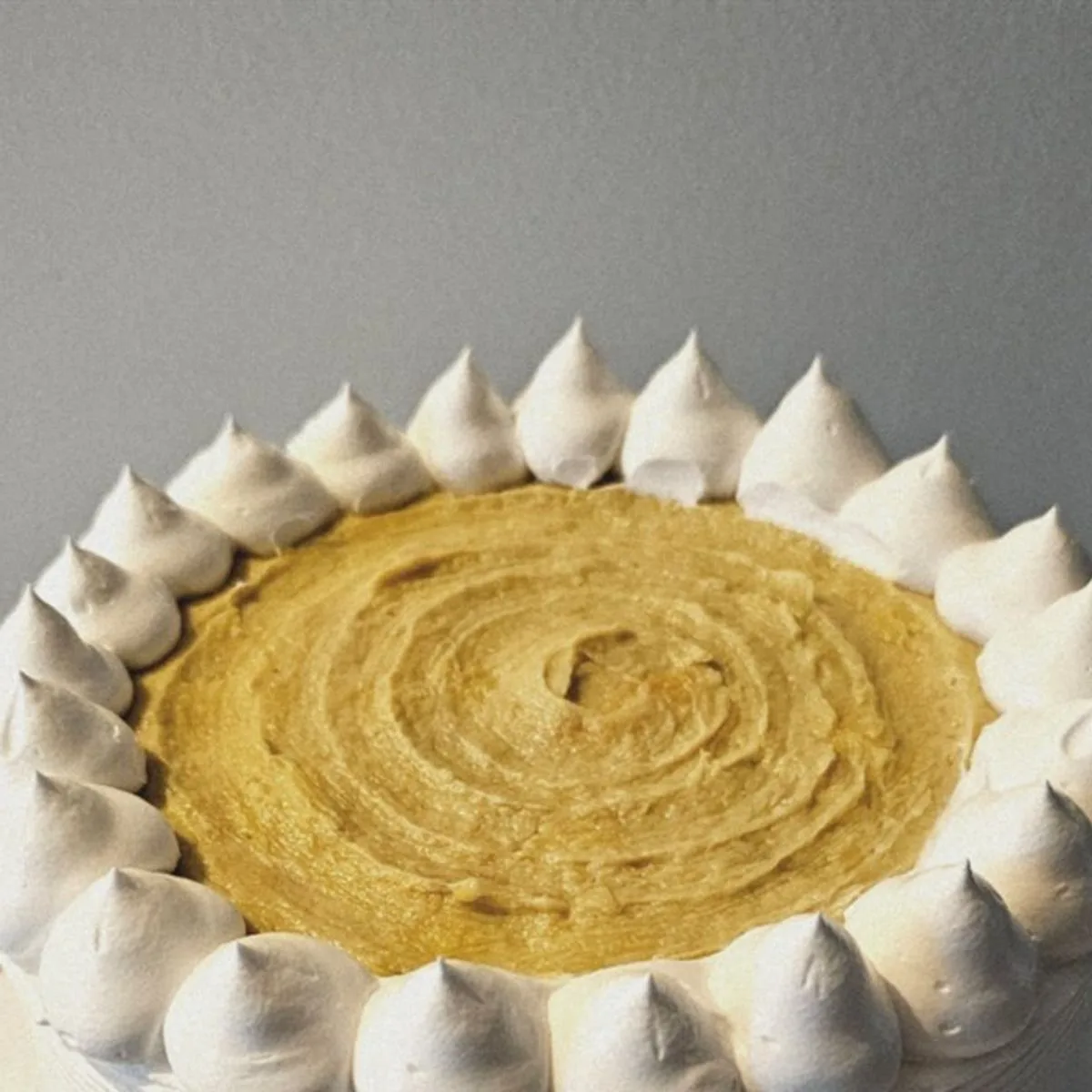 Durian cake topped with piped durian paste by Amour Desserts